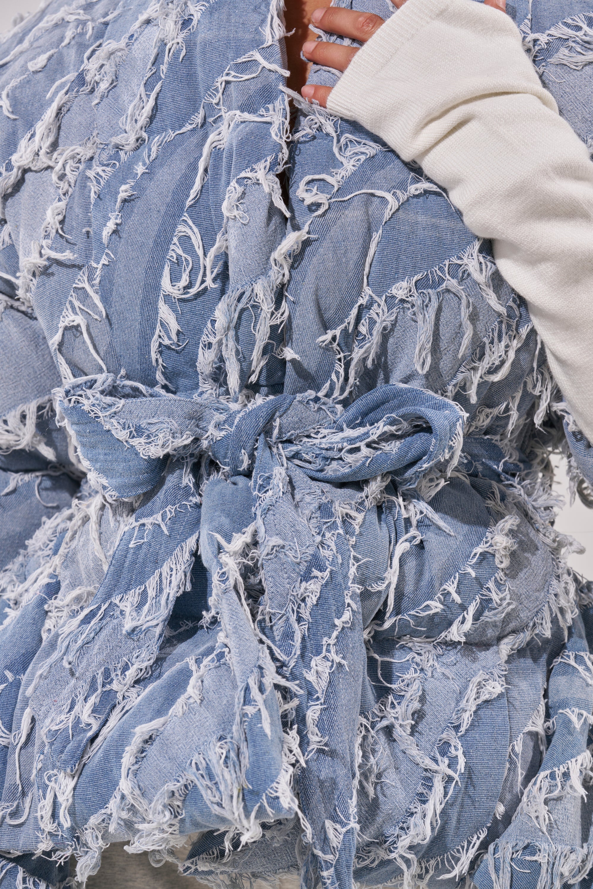 RIB SLEEVE PEPLUM PUFFER IN DENIM