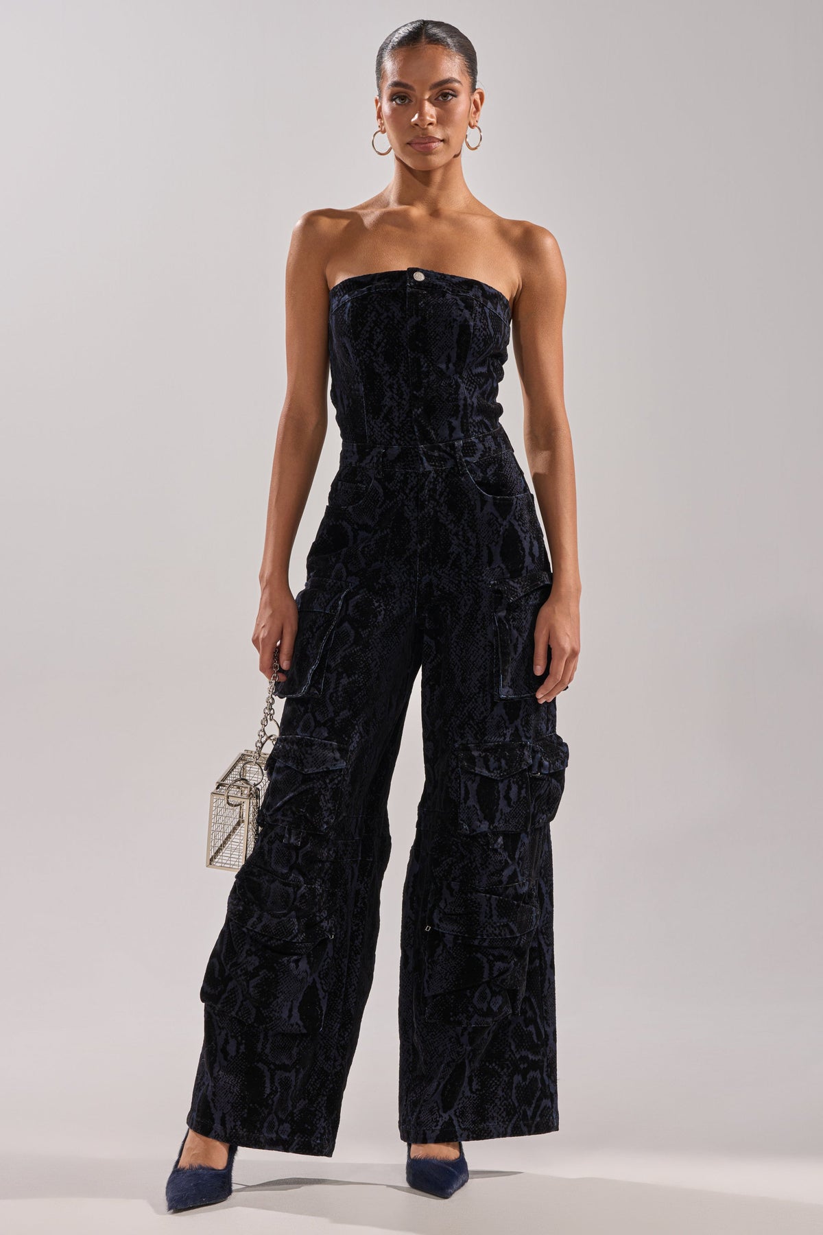 CAUGHT YOUR EYE VELVET DENIM JUMPSUIT IN SNAKEPRINT